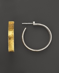 Utterly timeless, Gurhan's sterling silver and 24K gold Hourglass hoops lend a classic look for everyday wear. Utterly timeless, Gurhan's sterling silver and 24K gold Hourglass hoops lend a classic look for everyday wear.