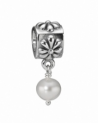 A floral sterling silver charm featuring a classic white freshwater pearl. By PANDORA. A floral sterling silver charm featuring a classic white freshwater pearl. By PANDORA.