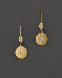 Hammered gold disc earrings are accented with diamond centers, for pierced ears. Designed by Meira T. Hammered gold disc earrings are accented with diamond centers, for pierced ears. Designed by Meira T.