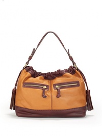 THE LOOKColorblock designShoulder strapMagnetic top closure with side drawstrings and tassel endsTwo outside zip pocketsOne inside zip pocketTwo inside open pocketsInside logo detailTHE MEASUREMENTShoulder strap, 10 drop15W X 10H X 5½DTHE MATERIALLeatherLogo printed liningORIGINImported THE LOOKColorblock designShoulder strapMagnetic top closure with side drawstrings and tassel endsTwo outside zip pocketsOne inside zip pocketTwo inside open pocketsInside logo detailTHE MEASUREMENTShoulder strap, 10 drop15W X 10H X 5½DTHE MATERIALLeatherLogo printed liningORIGINImported