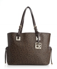 Ideal for the girl-on-the-go, this roomy tote by Calvin Klein will have plenty of space for your everyday necessities. A monogram exterior with signature hardware and side pockets will keep you organized all day long. Ideal for the girl-on-the-go, this roomy tote by Calvin Klein will have plenty of space for your everyday necessities. A monogram exterior with signature hardware and side pockets will keep you organized all day long.