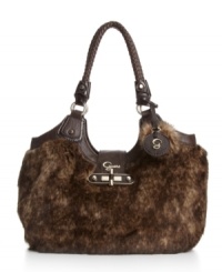 Trendsetting and animal friendly, the Lelah satchel bag from GUESS is plush with soft faux fur for a look that's ready for fall and winter. Trendsetting and animal friendly, the Lelah satchel bag from GUESS is plush with soft faux fur for a look that's ready for fall and winter.