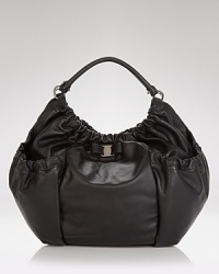 Salvatore Ferragamo gives its sought after hobo a relaxed update. In luxurious leather with bow detailing, this carryall will punctuate every pulled together look. Salvatore Ferragamo gives its sought after hobo a relaxed update. In luxurious leather with bow detailing, this carryall will punctuate every pulled together look.