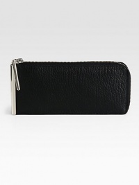 A sleek metal bar modernizes this pebbled leather essential. Zip-around closureOne inside zip compartmentEight credit card slots7¾W X 3½H X ¾DImported A sleek metal bar modernizes this pebbled leather essential. Zip-around closureOne inside zip compartmentEight credit card slots7¾W X 3½H X ¾DImported