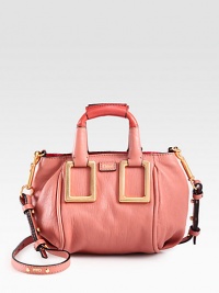Softly shaped leather essential accented with oversized buckles and contrast leather panels for a casual touch.Colorblocked double top handles, 3½ dropRemovable, adjustable crossbody strap, 22-23 dropTop zip closure with contrast trimOne inside open pocketCotton lining7W X 4¼H X 4DMade in Italy Softly shaped leather essential accented with oversized buckles and contrast leather panels for a casual touch.Colorblocked double top handles, 3½ dropRemovable, adjustable crossbody strap, 22-23 dropTop zip closure with contrast trimOne inside open pocketCotton lining7W X 4¼H X 4DMade in Italy