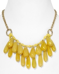 Take this season's love of bold colors to your jewel box with this beaded bib necklace from Aqua, accented by a cluster of yellow-colored drop beads and a textured chain. Take this season's love of bold colors to your jewel box with this beaded bib necklace from Aqua, accented by a cluster of yellow-colored drop beads and a textured chain.
