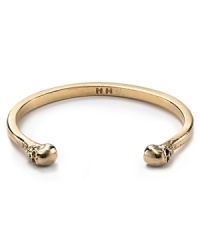 Give your jewel box a Gothic glam makeover with this plated cuff from House of Harlow 1960, accented by two yellow gold skulls. Give your jewel box a Gothic glam makeover with this plated cuff from House of Harlow 1960, accented by two yellow gold skulls.