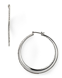 A jewel box treasure for now and forever, these graduated silver hoop earrings are dressed up in a rim of pristine pavé crystals. From Lauren Ralph Lauren. A jewel box treasure for now and forever, these graduated silver hoop earrings are dressed up in a rim of pristine pavé crystals. From Lauren Ralph Lauren.