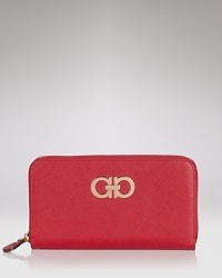 Polished and practical. Salvatore Ferragamo's logo-trimmed leather wallet is a rich spot to stow your cash, cards and coins. Polished and practical. Salvatore Ferragamo's logo-trimmed leather wallet is a rich spot to stow your cash, cards and coins.