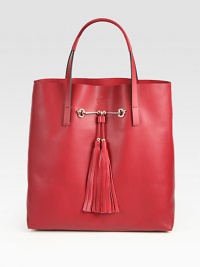 Embossed Gucci trademark and tassel detail defines this leather design. Double top handles, 5½ dropOne inner zipper pouch12½W X 13½H X 5DMade in Italy Embossed Gucci trademark and tassel detail defines this leather design. Double top handles, 5½ dropOne inner zipper pouch12½W X 13½H X 5DMade in Italy