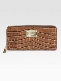 Chic and luxurious crocodile embossed leather design with a logo plaque.Zip-around closureOne inside zip pocketEight credit card slotsTwo bill compartmentsFully lined8¼W X 4H X ¾DImported Chic and luxurious crocodile embossed leather design with a logo plaque.Zip-around closureOne inside zip pocketEight credit card slotsTwo bill compartmentsFully lined8¼W X 4H X ¾DImported