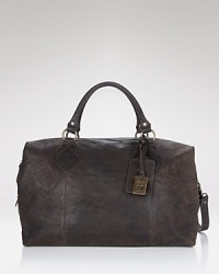 Rugged style for short trips. This weathered leather overnight bag has a top handle, adjustable strap and plenty of interior compartments for your weekend away. Rugged style for short trips. This weathered leather overnight bag has a top handle, adjustable strap and plenty of interior compartments for your weekend away.