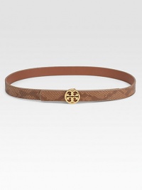 Snake print reverses to smooth, solid leather with goldtone logo hardware for an easy, versatile look.Width, about .875Made in USA Snake print reverses to smooth, solid leather with goldtone logo hardware for an easy, versatile look.Width, about .875Made in USA