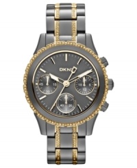 Dusky gunmetal tones blend impeccably with golden accents on this DKNY watch. Dusky gunmetal tones blend impeccably with golden accents on this DKNY watch.