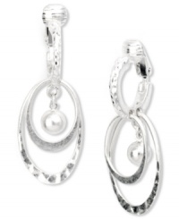 Drop everything for these chic hoops from Jones New York! Multiple ovals and a ball pendant make a unique statement. Crafted from worn silver tone mixed metal. Clip-on backing for non-pierced ears. Approximate drop: 1 inch. Drop everything for these chic hoops from Jones New York! Multiple ovals and a ball pendant make a unique statement. Crafted from worn silver tone mixed metal. Clip-on backing for non-pierced ears. Approximate drop: 1 inch.