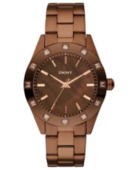 This DKNY watch boasts rich color and sparkling crystal accents for a magnetic look. This DKNY watch boasts rich color and sparkling crystal accents for a magnetic look.