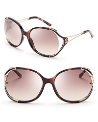 With leather and gold detailing, these oversized Roberto Cavalli frames exude over-the-top glamour. With leather and gold detailing, these oversized Roberto Cavalli frames exude over-the-top glamour.