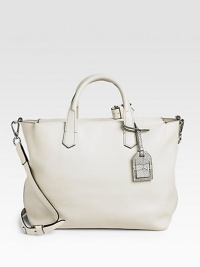 This ultra spacious leather carryall in a soft, muted palette works as a gym bag or workwear accessory.Double top handles, 4 drop Removable, adjustable crossbody strap, 19-22 drop Snakeskin luggage tag Top zip closure One inside zip pocket Two inside open pockets Cotton lining 14W X 10H X 6D Imported This ultra spacious leather carryall in a soft, muted palette works as a gym bag or workwear accessory.Double top handles, 4 drop Removable, adjustable crossbody strap, 19-22 drop Snakeskin luggage tag Top zip closure One inside zip pocket Two inside open pockets Cotton lining 14W X 10H X 6D Imported
