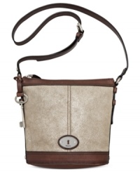 Simply chic, this classic crossbody from Fossil reels in old school charm with a contemporary attitude. Crafted from mod metallic suede and signature hardware, its pocket-lined interior keeps you organized anywhere. Simply chic, this classic crossbody from Fossil reels in old school charm with a contemporary attitude. Crafted from mod metallic suede and signature hardware, its pocket-lined interior keeps you organized anywhere.