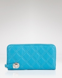 Already iconic, this Marc Jacobs wallet is crafted of quilted leather, finished with a magnetic snap closure. Its lined interior features 12 credit card pockets and two bill slots. Already iconic, this Marc Jacobs wallet is crafted of quilted leather, finished with a magnetic snap closure. Its lined interior features 12 credit card pockets and two bill slots.