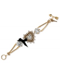A little heart goes a long way. This darling toggle bracelet from Betsey Johnson boasts a heart charm with crystal accents and large crystal stones with a black grosgrain ribbon bow. Crafted in antiqued gold tone mixed metal. Approximate length: 7-1/2 inches long. Approximate width: 1-1/2 inches. A little heart goes a long way. This darling toggle bracelet from Betsey Johnson boasts a heart charm with crystal accents and large crystal stones with a black grosgrain ribbon bow. Crafted in antiqued gold tone mixed metal. Approximate length: 7-1/2 inches long. Approximate width: 1-1/2 inches.