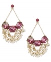 Clusters of glass pearls and fuchsia-colored crystal gems give these Betsey Johnson chandelier earrings extra charm. Crafted in antiqued gold tone mixed metal. Approximate drop: 3 inches.