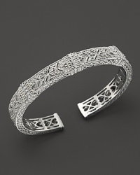 Intricate cutouts lend a unique look to this Judith Ripka cuff, accented with sparkling white sapphires. Intricate cutouts lend a unique look to this Judith Ripka cuff, accented with sparkling white sapphires.