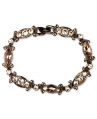 Refresh your look. Givenchy's alluring flex bracelet features silk Swarovski stones. Set in brown gold tone mixed metal. Approximate length: 7-1/4 inches. Refresh your look. Givenchy's alluring flex bracelet features silk Swarovski stones. Set in brown gold tone mixed metal. Approximate length: 7-1/4 inches.