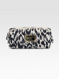 Carry essential beauty items in this sleek bag with signature letter stitching and a vivid graphic print. Top zip closureFully lined7½W X 3H X 2½DImported Carry essential beauty items in this sleek bag with signature letter stitching and a vivid graphic print. Top zip closureFully lined7½W X 3H X 2½DImported