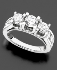 A three stone diamond ring with sophisticated details. Three-round cut diamonds are set in 14k white gold and accented with glittering, round-cut diamonds along the shank (3 ct. t.w.). A three stone diamond ring with sophisticated details. Three-round cut diamonds are set in 14k white gold and accented with glittering, round-cut diamonds along the shank (3 ct. t.w.).