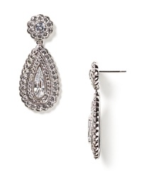 With a classic elegance that will set off any look, this large teardrop earring from Nadri is gleaming with textured teardrop and floral stone patterns. With a classic elegance that will set off any look, this large teardrop earring from Nadri is gleaming with textured teardrop and floral stone patterns.