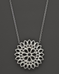 An applique pendant in sterling silver on a chain, designed by Paul Morelli. An applique pendant in sterling silver on a chain, designed by Paul Morelli.