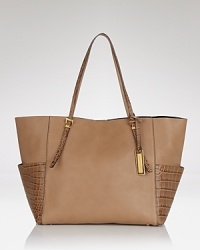 Throw something chic over your shoulder with this richly textured tote from Michael Kors. In rich leather with a roomy interior, it's the daytime bag that no outfit should be without. Throw something chic over your shoulder with this richly textured tote from Michael Kors. In rich leather with a roomy interior, it's the daytime bag that no outfit should be without.