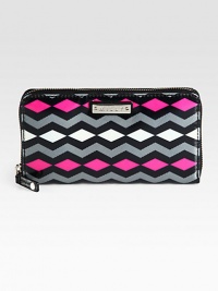 Ultra-protective coated fabric takes on a retro-inspired print in bold hues. Zip-around closureOne inside zip pocketTwo bill compartmentsTwelve credit card slotsFully lined7½W X 4½H X 1DImported Ultra-protective coated fabric takes on a retro-inspired print in bold hues. Zip-around closureOne inside zip pocketTwo bill compartmentsTwelve credit card slotsFully lined7½W X 4½H X 1DImported