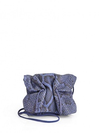 THE LOOKCrossbody strapCinched flapMagnetic tab closure under flapDrawstring topInside logo detailTHE MEASUREMENTCrossbody strap, 32 drop5W X 4H X 2½DTHE MATERIALPythonLeather and printed fabric liningORIGINMade in USA THE LOOKCrossbody strapCinched flapMagnetic tab closure under flapDrawstring topInside logo detailTHE MEASUREMENTCrossbody strap, 32 drop5W X 4H X 2½DTHE MATERIALPythonLeather and printed fabric liningORIGINMade in USA