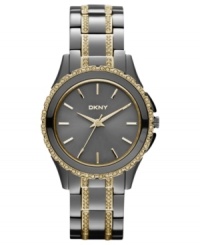 Dusky gunmetal tones blend impeccably with golden accents on this DKNY watch. Dusky gunmetal tones blend impeccably with golden accents on this DKNY watch.