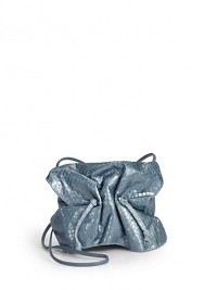 THE LOOKCrossbody strapCinched flapMagnetic tab closure under flapDrawstring topInside logo detailTHE MEASUREMENTCrossbody strap, 32 drop5W X 4H X 2½DTHE MATERIALPythonLeather and printed fabric liningORIGINMade in USA THE LOOKCrossbody strapCinched flapMagnetic tab closure under flapDrawstring topInside logo detailTHE MEASUREMENTCrossbody strap, 32 drop5W X 4H X 2½DTHE MATERIALPythonLeather and printed fabric liningORIGINMade in USA