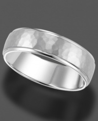 A timeless ring in 14k white gold, featuring engraving and a subtle, mottled texture. A timeless ring in 14k white gold, featuring engraving and a subtle, mottled texture.