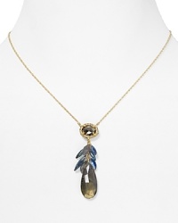 A gold plated chain necklace suspends a striking, clustered pendant, composed of crystals and semi-precious stones. From Alexis Bittar. A gold plated chain necklace suspends a striking, clustered pendant, composed of crystals and semi-precious stones. From Alexis Bittar.