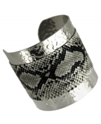 Slink into something fierce. GUESS adds sultry style with this cuff bracelet with a black and white snake print. Crafted from textured imitation rhodium silver tone mixed metal. Approximate diameter: 2-1/4 inches. Slink into something fierce. GUESS adds sultry style with this cuff bracelet with a black and white snake print. Crafted from textured imitation rhodium silver tone mixed metal. Approximate diameter: 2-1/4 inches.