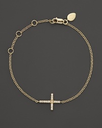 A diamond-studded cross adds elegance to this slender, adjustable 14K. yellow gold bracelet from Meira T. A diamond-studded cross adds elegance to this slender, adjustable 14K. yellow gold bracelet from Meira T.