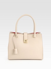 Instantly classic leather silhouette with double top handles and a flap lock closure. Double top handles, 7 dropLock closure on front flapOne outside back zip pocketOne inside zip pocketFully lined9W X 12½H X 5DMade in Italy Instantly classic leather silhouette with double top handles and a flap lock closure. Double top handles, 7 dropLock closure on front flapOne outside back zip pocketOne inside zip pocketFully lined9W X 12½H X 5DMade in Italy