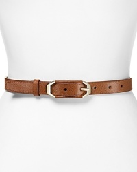 Cole Haan contours your look this season with a simply styled leather belt, which closes with an end-bar buckle. Cole Haan contours your look this season with a simply styled leather belt, which closes with an end-bar buckle.