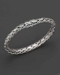 Shining sterling silver adds elegance to this hand-woven bracelet, finished with beautiful inner details. Shining sterling silver adds elegance to this hand-woven bracelet, finished with beautiful inner details.