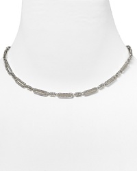 Stand out from the in-crowd in this silvery link collar necklace from Nadri, decked in delicate crystals. This vintage-inspired piece is an elegance epitomized. Stand out from the in-crowd in this silvery link collar necklace from Nadri, decked in delicate crystals. This vintage-inspired piece is an elegance epitomized.