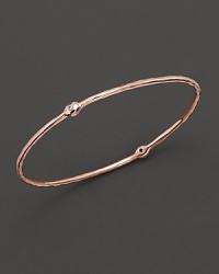 From the Rosé collection, a two-diamond hammered bangle. Designed by Ippolita. From the Rosé collection, a two-diamond hammered bangle. Designed by Ippolita.