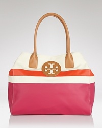 Perfect preppy accessorizing with this coolly color blocked tote from Tory Burch. Whether you're beach bound or simply running errands in the city, this durable canvas bag is ideally sized to carry it all. Perfect preppy accessorizing with this coolly color blocked tote from Tory Burch. Whether you're beach bound or simply running errands in the city, this durable canvas bag is ideally sized to carry it all.