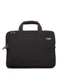 Take the world by storm when you carry this handsome brief by Jack Spade, designed to hold all your critical workday essentials. Take the world by storm when you carry this handsome brief by Jack Spade, designed to hold all your critical workday essentials.