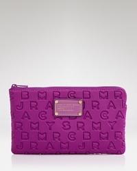 Pouch your bets with this MARC BY MARC JACOBS accessory, which effortlessly mixes modern-day necessity with of-the-moment cool, crafted of durable neoprene. Pouch your bets with this MARC BY MARC JACOBS accessory, which effortlessly mixes modern-day necessity with of-the-moment cool, crafted of durable neoprene.