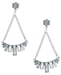 Chandelier chic from GUESS. These drop earrings flaunt baguette-cut crystal stones placed in a row, strung from linked chains. Crafted in imitation rhodium tone mixed metal. Approximate drop: 3 inches. Chandelier chic from GUESS. These drop earrings flaunt baguette-cut crystal stones placed in a row, strung from linked chains. Crafted in imitation rhodium tone mixed metal. Approximate drop: 3 inches.